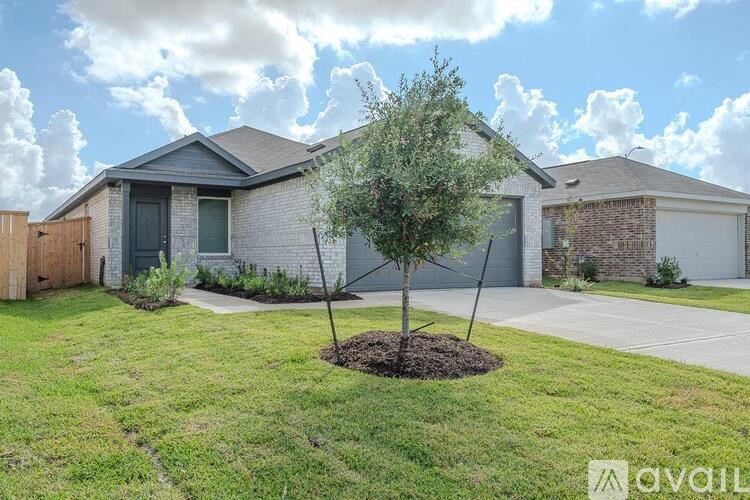 A house with a tree in front of it.
