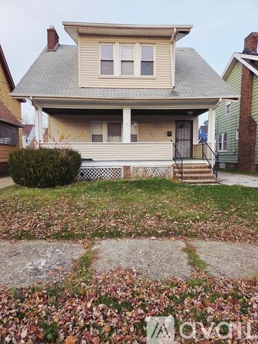 A house with a front yard and a lawn.