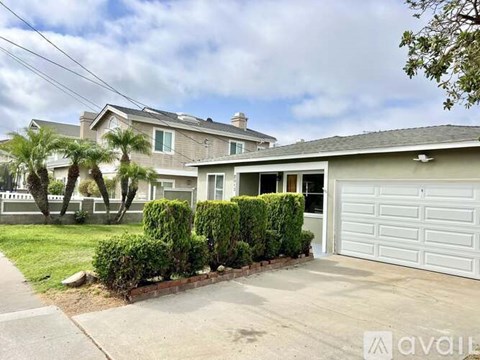 A house with a white garage door is for sale.