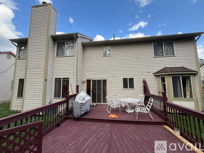 A house with a deck and patio furniture.
