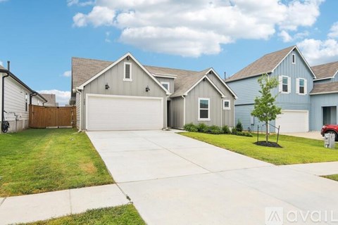 A house with a garage is available for sale.