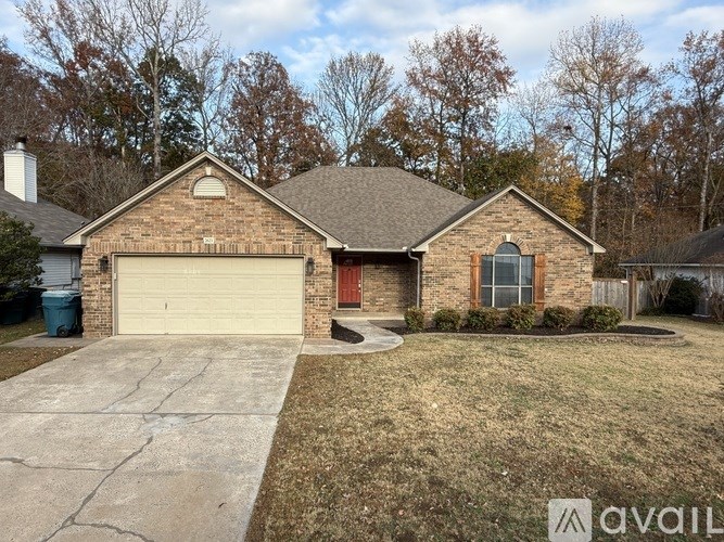 A house with a red door and a garage.