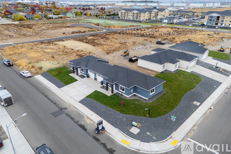 A residential area with houses and a road.