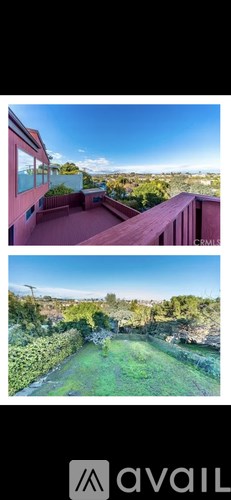 A balcony overlooking a green landscape.