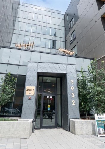 The number 3932 is displayed on the front door of a building.