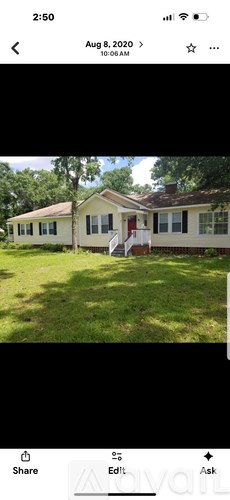 A house with a red door and white trim is shown.