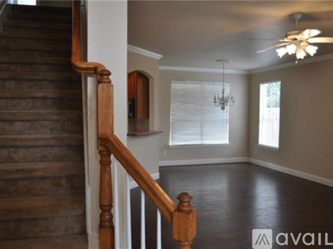 A staircase with wooden balusters and handrails.