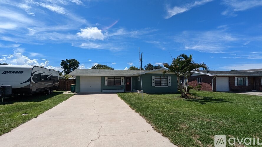 A sunny day at a residential area with houses and a clear sky.