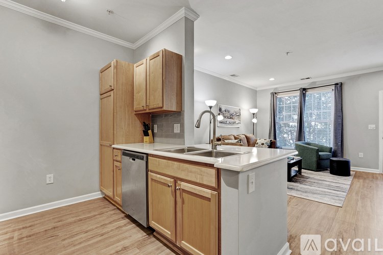 A kitchen with wooden cabinets and a white countertop.