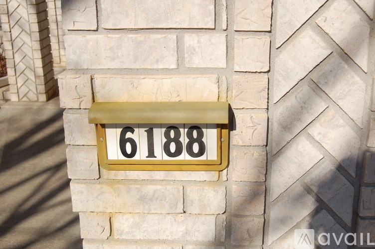 A house number sign with the number 61888 on it.