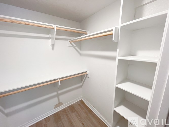 Empty white shelves in a room.
