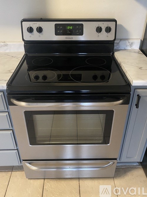 A stainless steel oven with a digital display on top is set to 375 degrees.