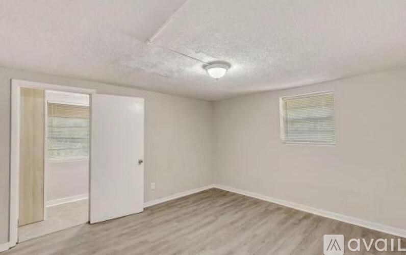 A room with a door and a window.