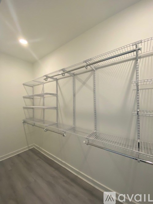 A wall of metal shelving units in a room.