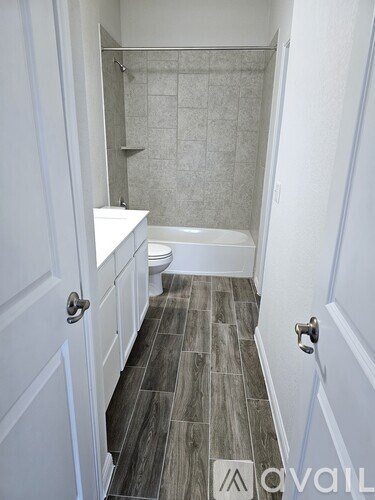 A bathroom with a walk in shower and a toilet.