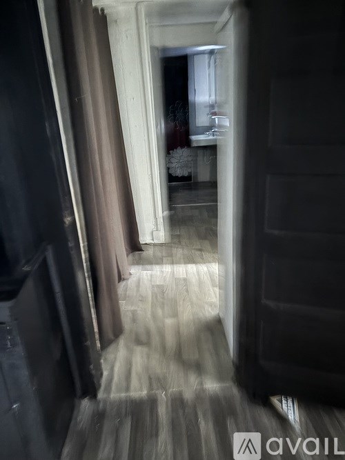 A hallway with a light at the end.