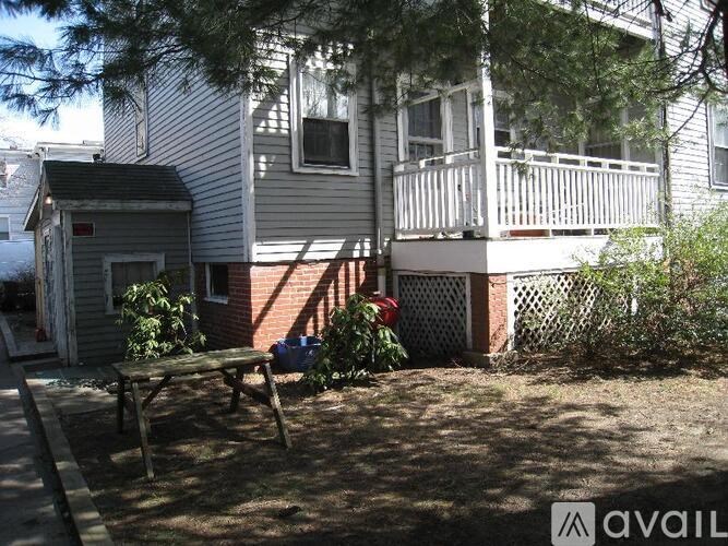 A house with a porch and a small garden area.