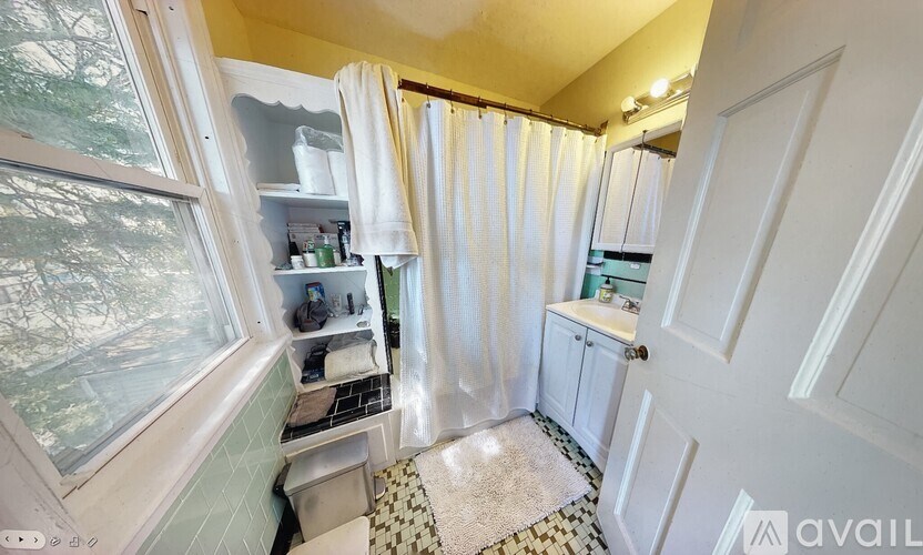 A bathroom with a window and a sink.