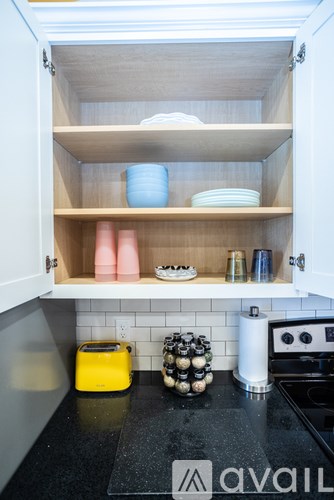 A kitchen with a toaster and a stove.