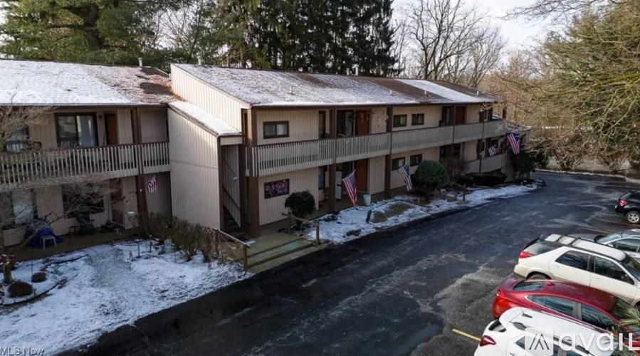 A building with a parking lot in front of it.