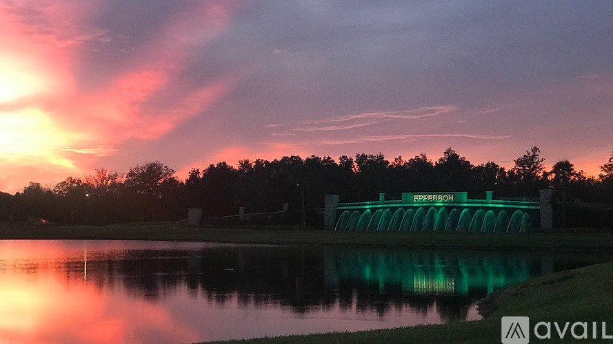 A dam with the word "PRESSON" written on it is reflected in the water.