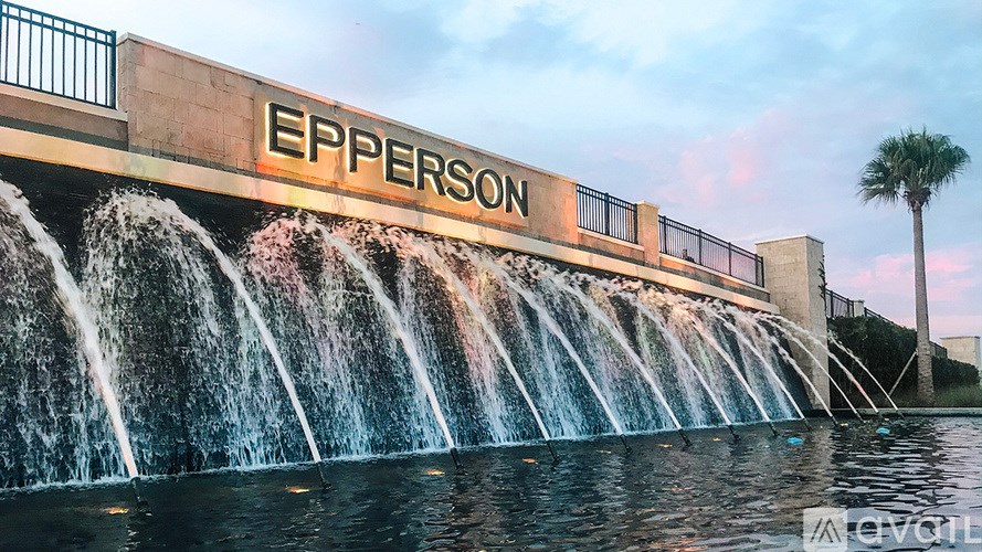 A waterfall cascades down a wall with the word "EPPERSON" on it.