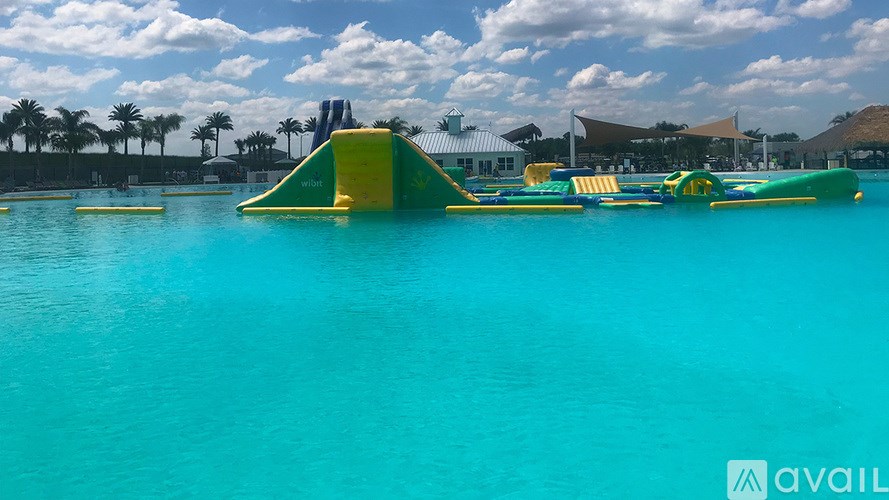 A water park with a slide and a pool.