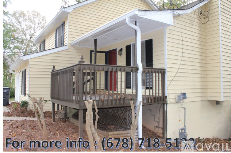 A yellow house with a porch and a phone number on the image.