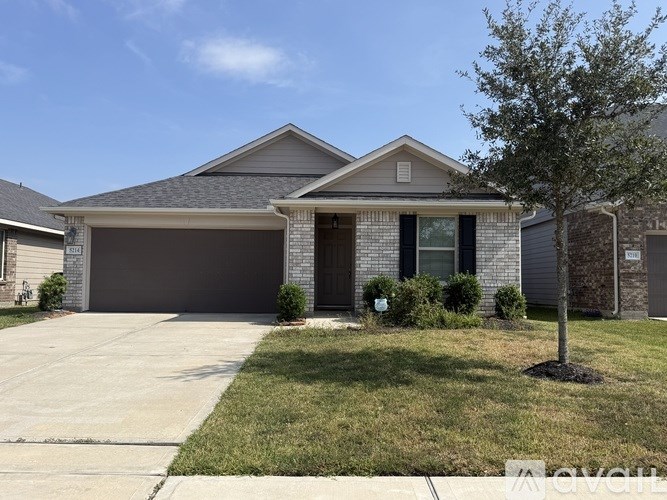 A house with a grey roof and a grey garage door.