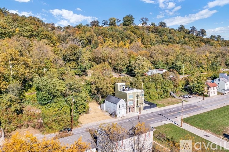 A view of a residential area with houses and trees.
