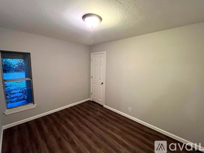 A room with a door and a window.