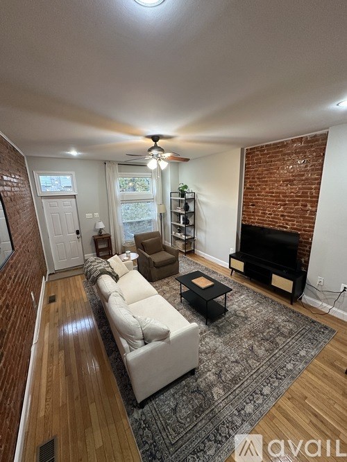 A living room with a fireplace and a couch.