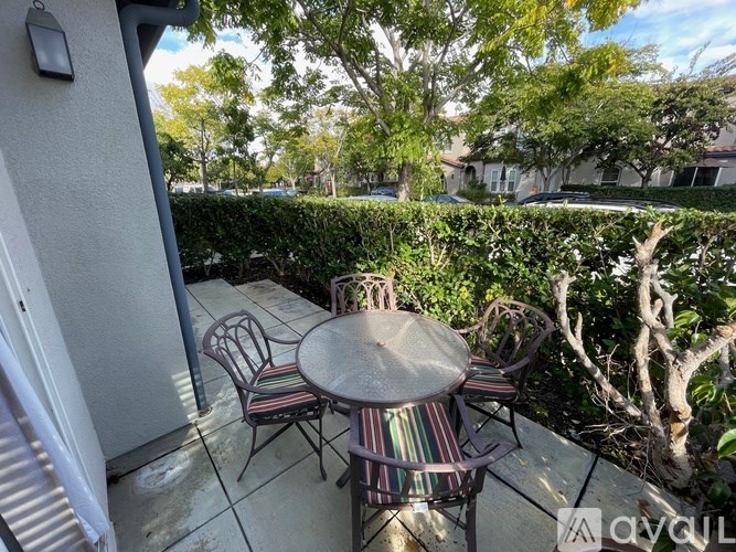 A patio with a table and chairs is shown.