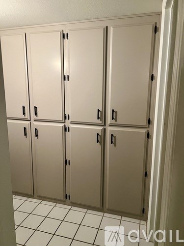 A row of white lockers in a room.