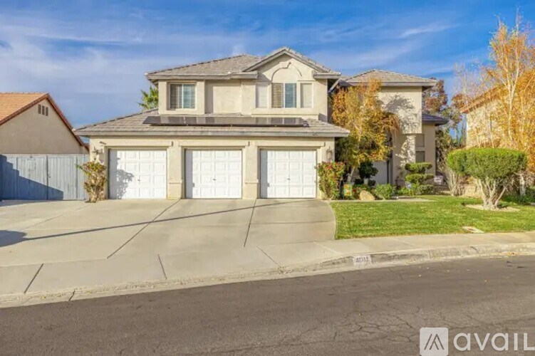 A house with a garage is for sale.