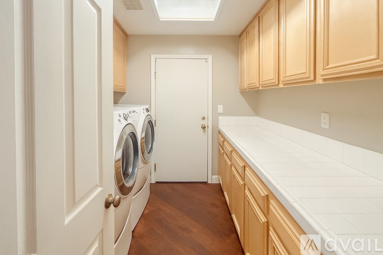 A laundry room with a washer and dryer in it.