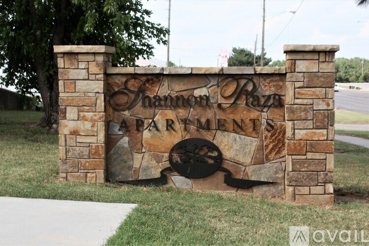 A sign for Shannon Prairie Farms is displayed in front of a grassy area.