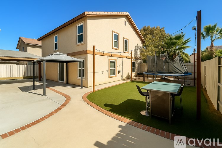 A house with a patio and a hot tub.