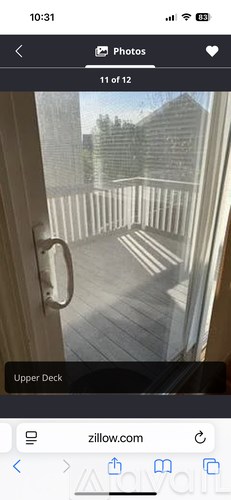 A view from a doorway looking out to a deck.