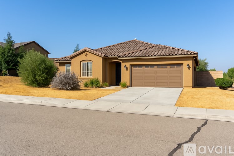 A house with a brown roof and a garage door.