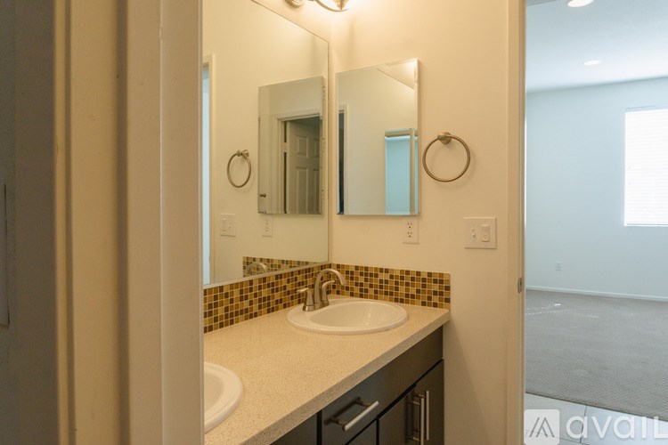 A bathroom with a sink and mirror.