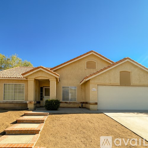 A house with a brown roof and a white garage door.