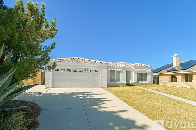 A house with a white garage door is for sale.