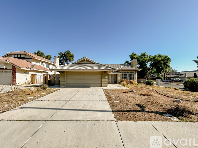 A house with a driveway in front of it is for sale.