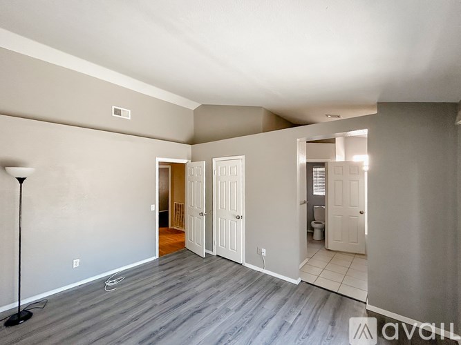 A room with a grey floor and white walls.