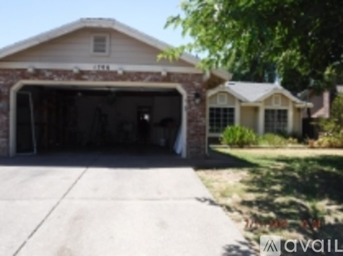 A house with a garage and a driveway.