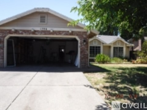 A house with a garage and a driveway.