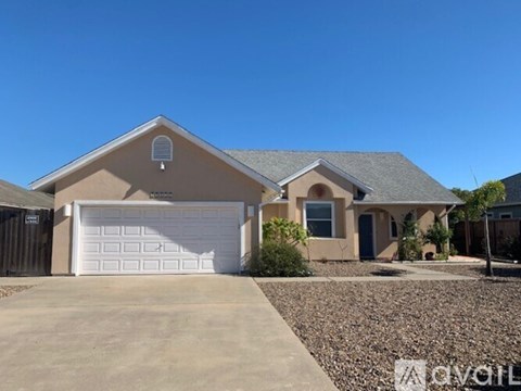 A house with a garage and a driveway.