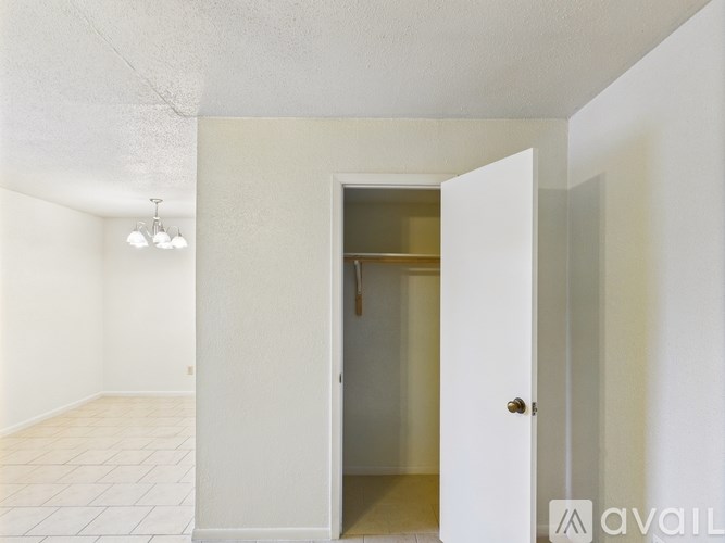 A room with a doorway leading to another room.