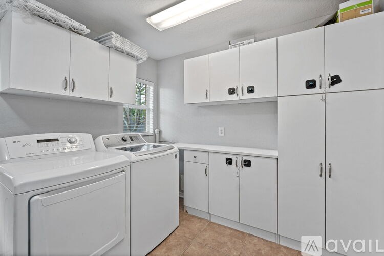 A laundry room with a washer and dryer.